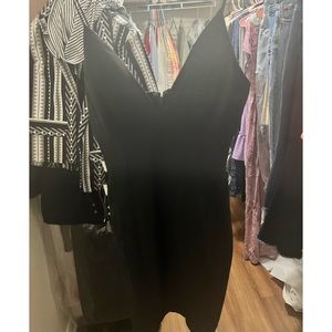 Beautiful mini dress with rhinestone cut outs.